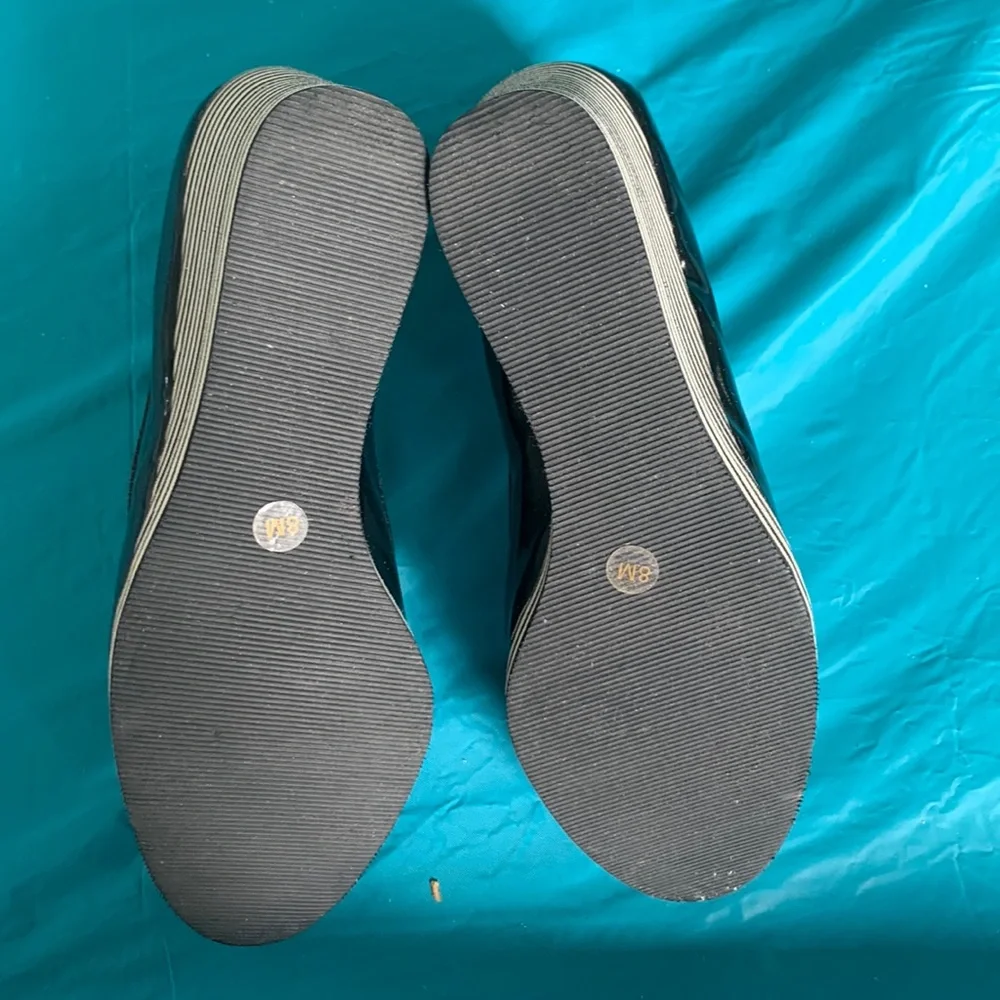 Gently worn Michael Kors Adlai’s Black and Cream Strip Wedge Shoes.